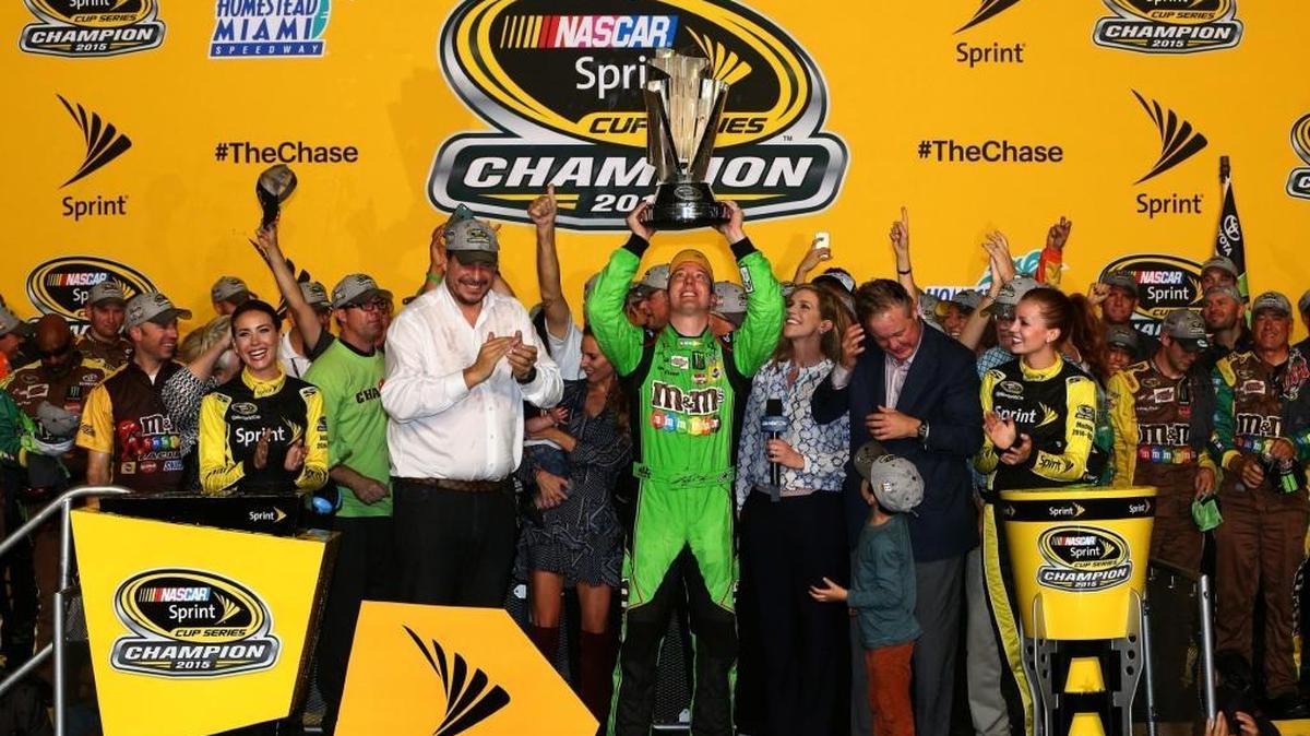 Kyle Busch, driver of the No. 18 Toyota, celebrates in Victory Lane after winning the series championship and the NASCAR Sprint Cup Series Ford EcoBoost 400 at Homestead-Miami Speedway on Sunday.