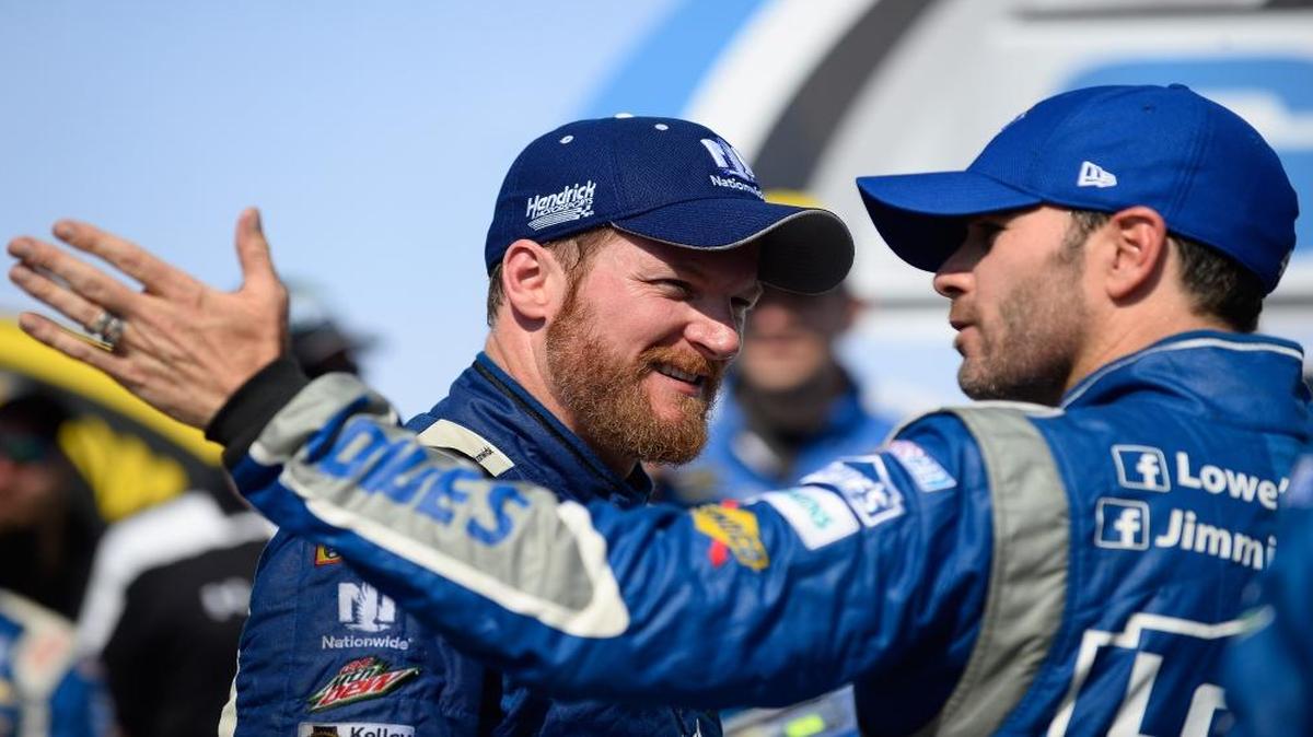 Defending Cup Series champ Jimmie Johnson, right, finished 11th in Sunday’s Toyota Owners 400 while teammate Dale Earnhardt Jr., left, ended up in 30th.