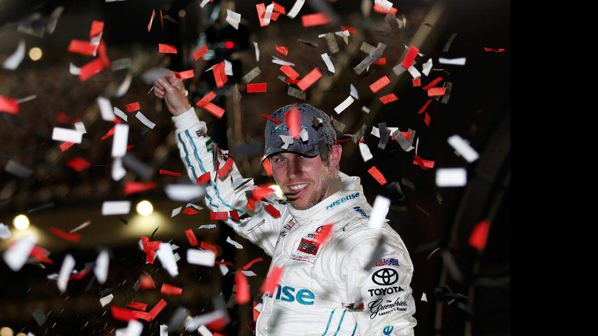 
Denny Hamlin celebrates in Victory Lane after winning the NASCAR XFINITY Series ToyotaCare 250 at Richmond International Raceway on Friday, April 24, 2015 in Richmond, Va.
