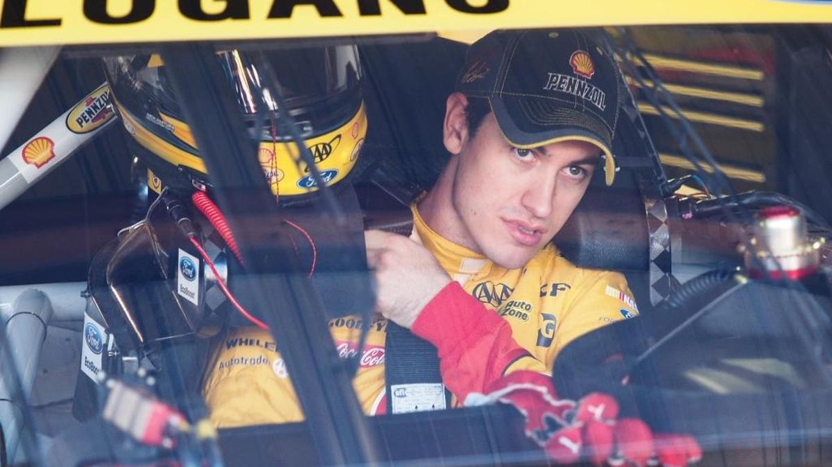 NASCAR Sprint Cup driver Joey Logano straps himself in for the first practice session for Sunday's NASCAR Sprint Cup auto race at Martinsville Speedway in Martinsville, Va., Friday.