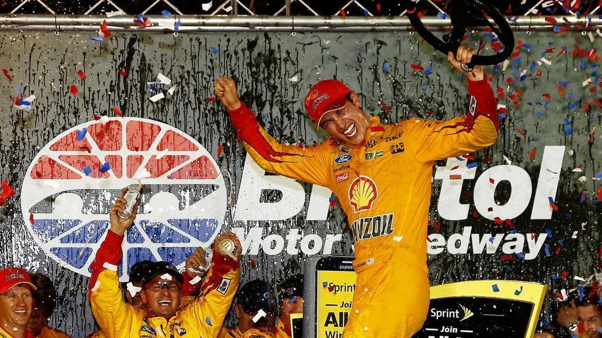 
Joey Logano celebrates in Victory Lane with his Team Penske crew after winning the NASCAR Sprint Cup Series race at Bristol Motor Speedway on Saturday, August 22, 2015 in Bristol, Tenn. It was the third victory of the season for Logano, who won the same event in 2014.
