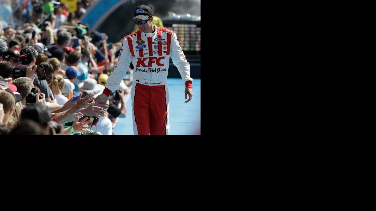 
David Ragan greets fans as he is introduced before the start of the Daytona 500 NASCAR Sprint Cup series auto race at Daytona International Speedway in Daytona Beach, Fla., Sunday, Feb. 22, 2015.
