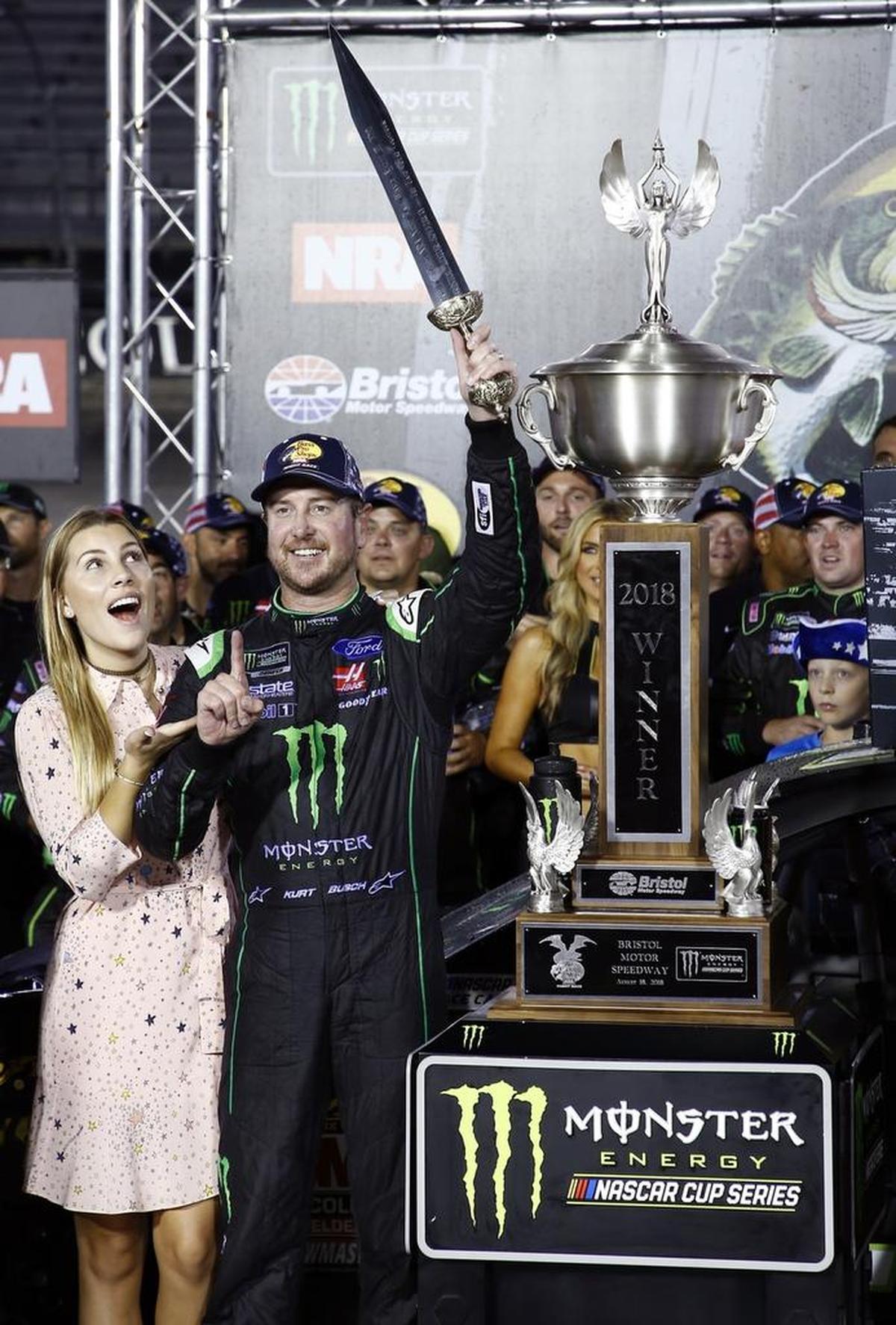 Kurt Busch celebrates with his wife, Ashley Van Metre, after winning Saturday night’s Cup Series race at Bristol Motor Speedway in Bristol, Tenn.