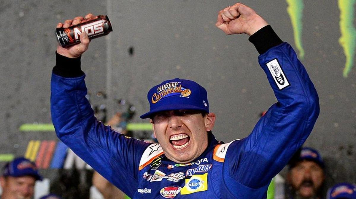NASCAR driver Kyle Busch celebrates winning the NASCAR All-Star Race on Saturday, his first Cup series victory at Charlotte Motor Speedway.