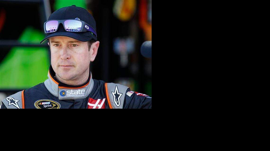 
Kurt Busch looks from the garage after practice for the NASCAR Bank of America Sprint Cup series auto race at Charlotte Motor Speedway on Oct. 9, 2014. NASCAR lifted its suspension of Kurt Busch on Wednesday and ruled the former champion can compete in the title Chase should he qualify. Busch missed the first three races of the season when NASCAR suspended him over allegations of domestic assault on his ex-girlfriend.
