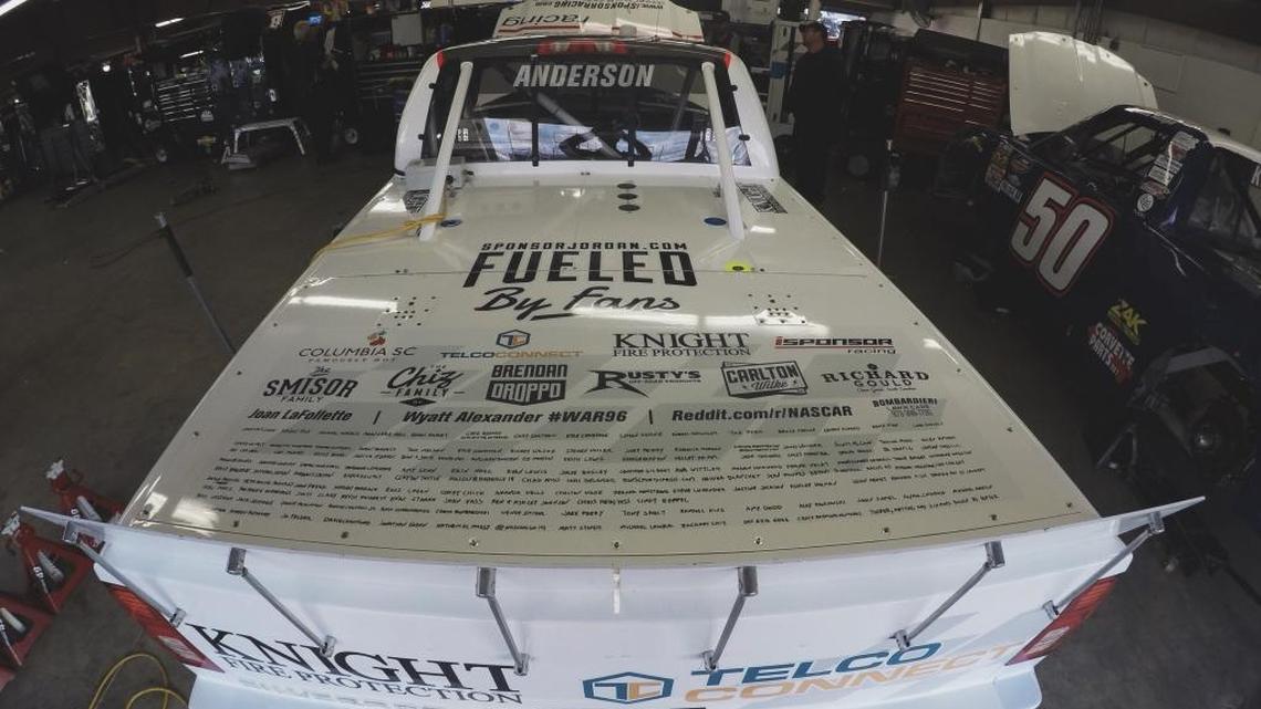 Jordan Anderson wrote the names of fans who helped sponsor him this weekend at New Hampshire Motor Speedway on the rear deck of his No. 66 Chevy Truck.