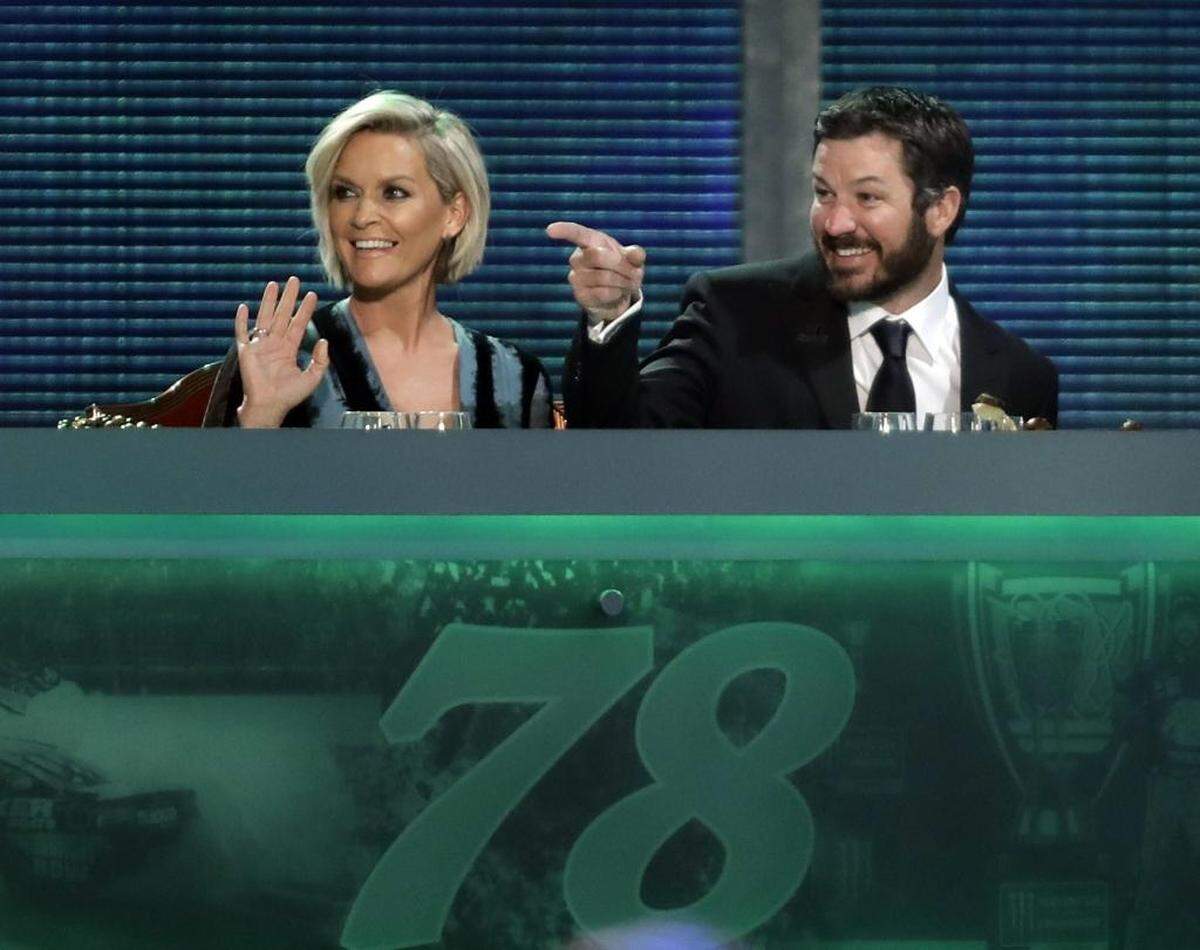 Martin Truex Jr., right, and Sherry Pollex sit at the champions' table during Nov. 30 NASCAR Cup Series auto racing awards in Las Vegas. Now would be a good point to just freeze time and savor everything he has going for him.