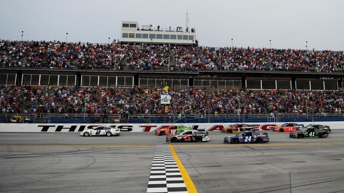Brad Keselowski, driver of the #2 Miller Lite Ford, takes the checkered flag to win the NASCAR Sprint Cup Series GEICO 500 at Talladega Superspeedway on May 1, 2016 in Talladega, Alabama.
