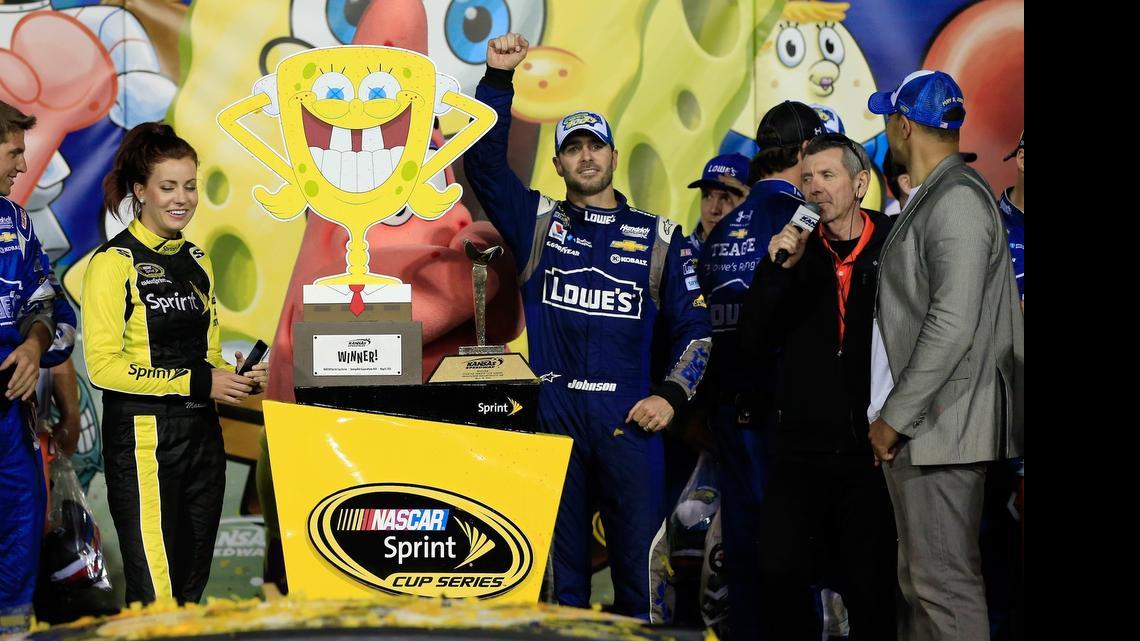 
KANSAS CITY, KS - MAY 09: Jimmie Johnson, driver of the #48 Lowe's Chevrolet, celebrates in Victory Lane after winning the NASCAR Sprint Cup Series SpongeBob SquarePants 400 at Kansas Speedway on May 9, 2015 in Kansas City, Kansas. (Photo by Jamie Squire/Getty Images) 
