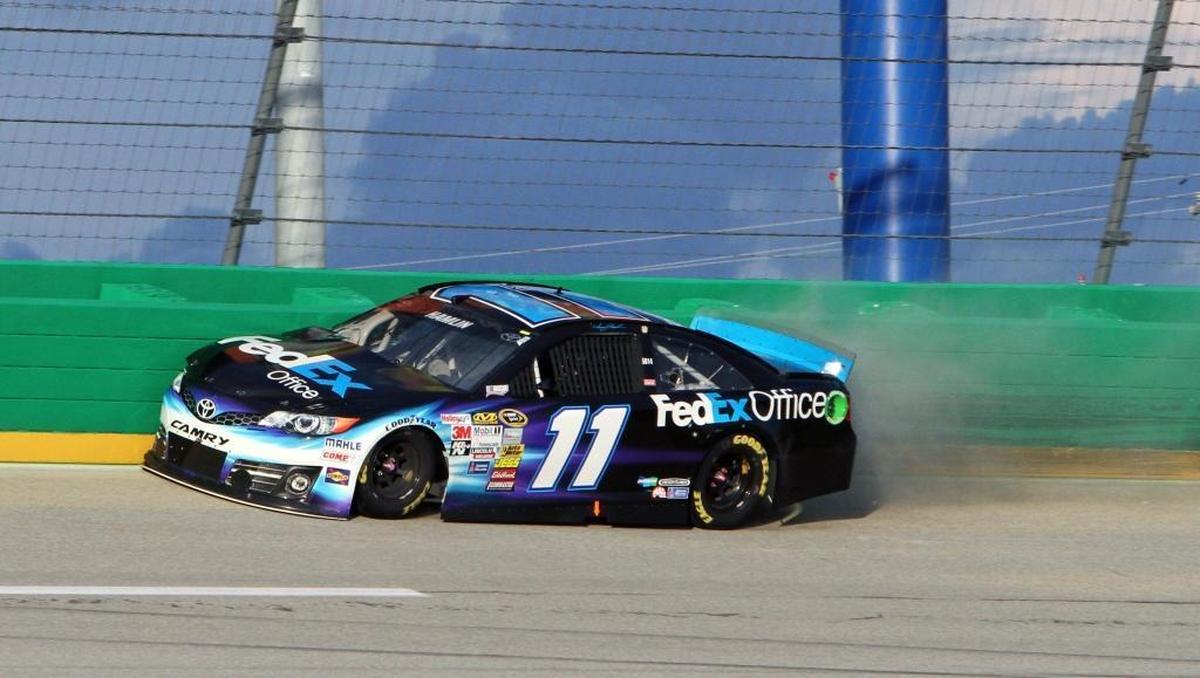 Denny Hamlin hits the outside wall between Turns 3 and 4 during a Cup Series race at Kentucky Speedway in Sparta, Ky. “It takes you about 30 minutes of practice to get your nerves up,” Hamlin said about racing through Turn 3.