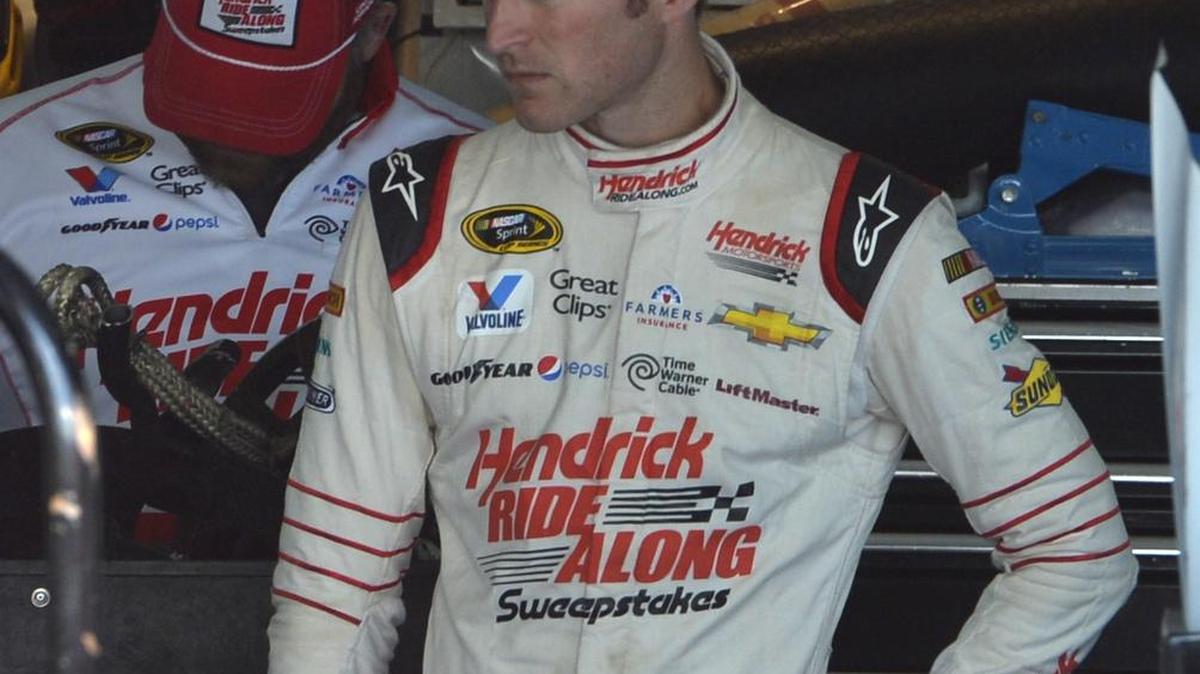 
Kasey Kahne, driver of the HendrickRiseAlong.com Chevrolet, watches as his crew attempts to repair his car after hitting the wall early in the NASCAR Sprint Cup Bank of America 500 at Charlotte Motor Speedway, Sunday, October 11, 2015.
