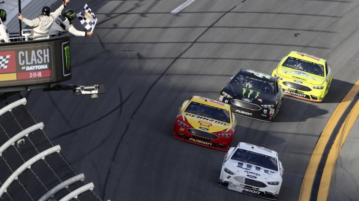 Brad Keselowski, front, takes the checkered flag to win Sunday’s Advance Auto Parts Clash ahead of Joey Logano, Kurt Busch and Ryan Blaney at Daytona International Speedway in Daytona Beach, Fla. All four drivers were in Fords.