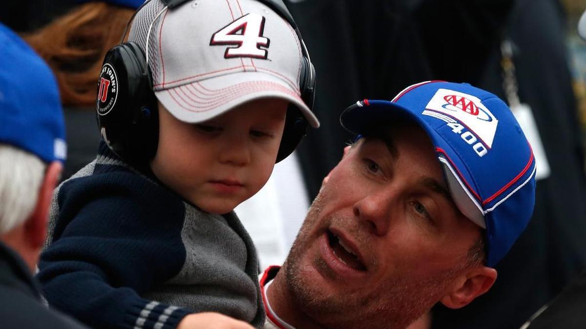 
Kevin Harvick, driver of the #4 Budweiser/Jimmy John's Chevrolet, and his son Keelan celebrates in victory lane after winning the NASCAR Sprint Cup Series AAA 400 at Dover International Speedway on October 4, 2015 in Dover, Delaware. 
