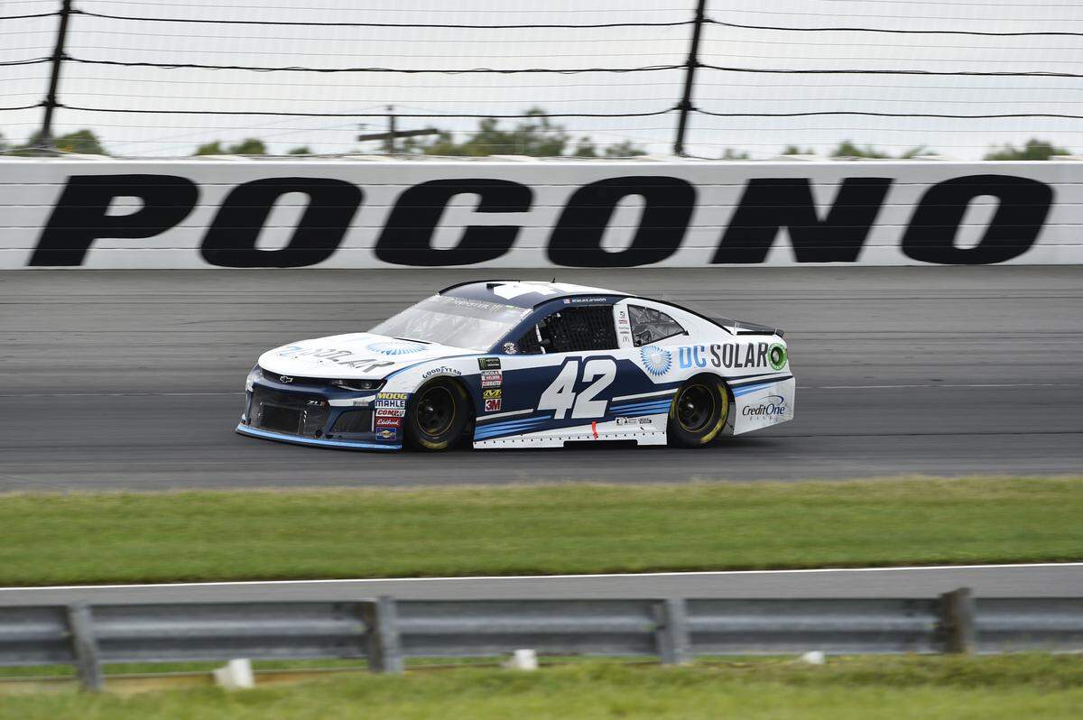 Kyle Larson drives through Turn 3 during a NASCAR Cup Series auto race, Sunday, June 3, 2018, in Long Pond, Pa. Martin Truex Jr. won the race. (AP Photo/Derik Hamilton)
