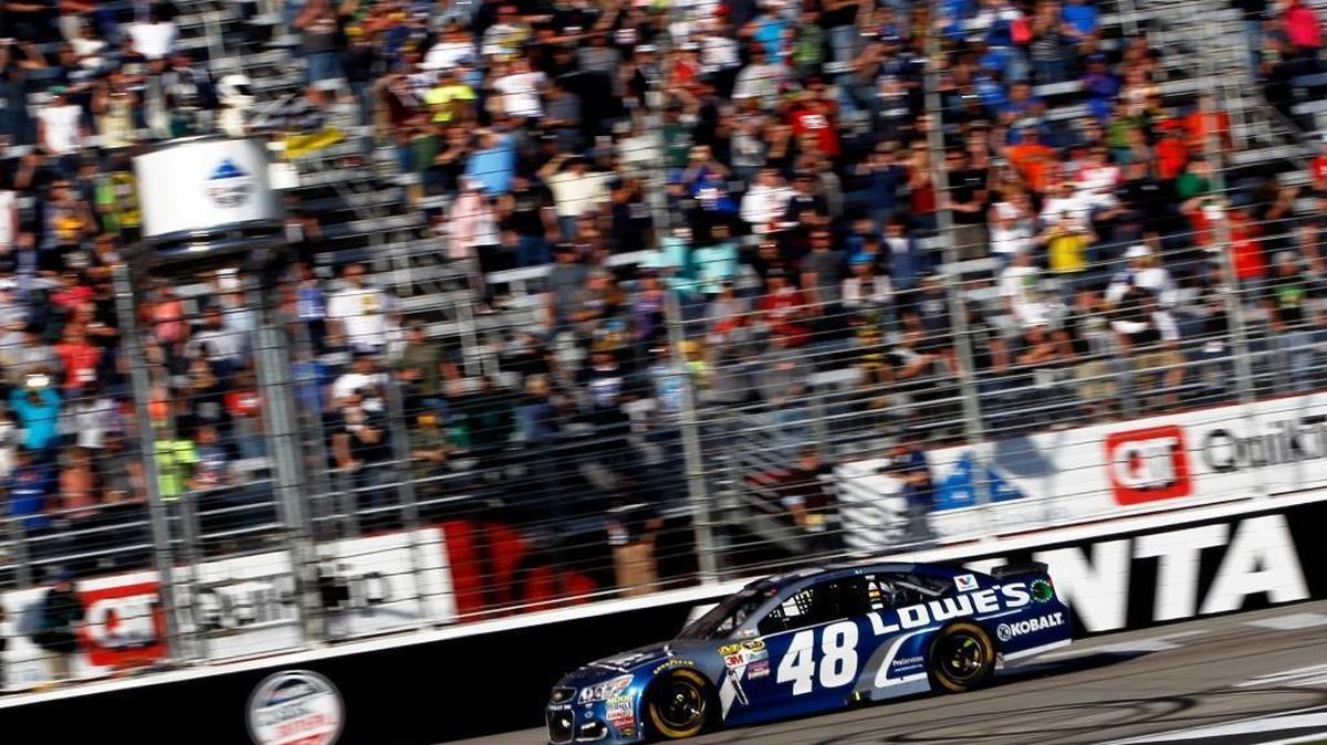 Jimmie Johnson takes the checkered flag to win Sunday’s Folds of Honor QuikTrip 500 at Atlanta Motor Speedway.