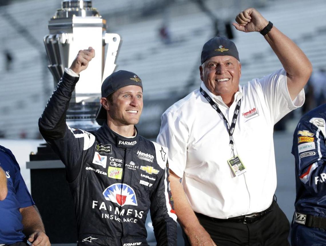 Kasey Kahne, left, celebrates with team owner Rick Hendrick after winning Sunday’s NASCAR Brickyard 400 auto race at Indianapolis Motor Speedway.