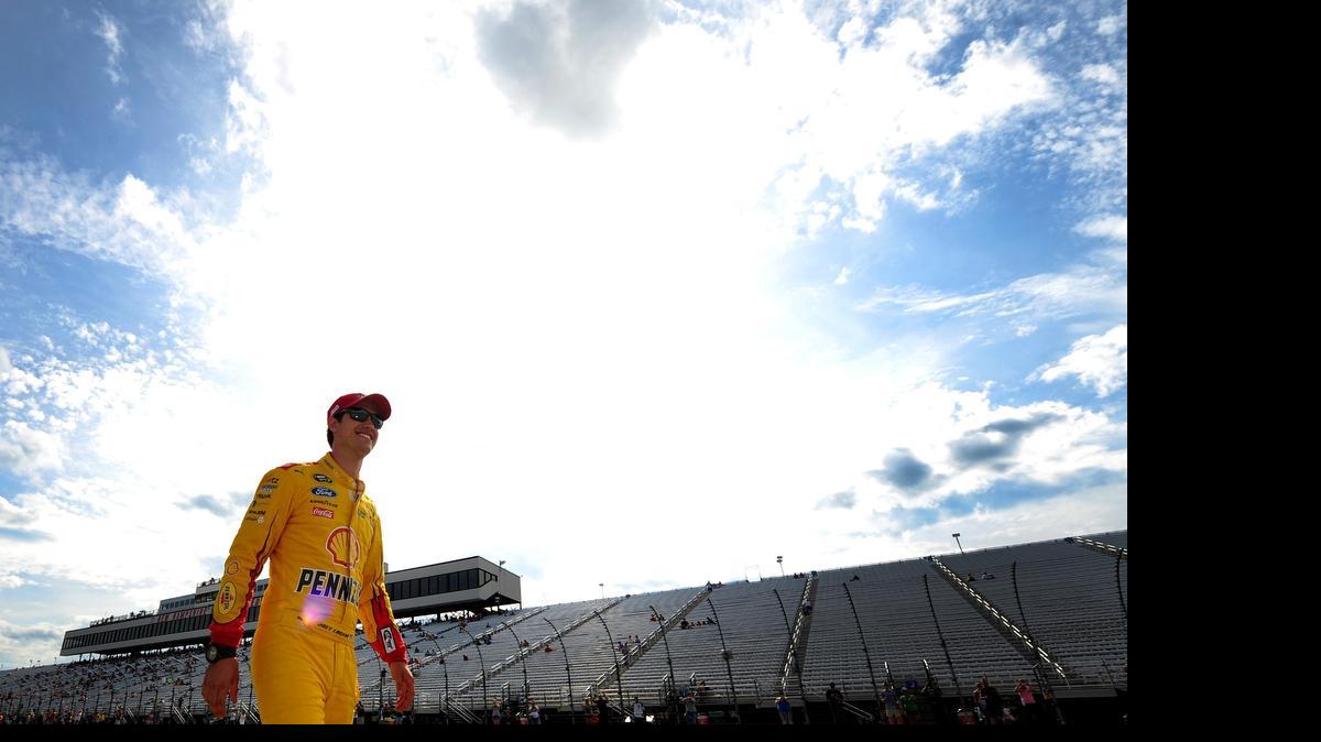 
Joey Logano walks on the grid during qualifying for the NASCAR Sprint Cup Series 5-Hour Energy 301 at New Hampshire Motor Speedway on July 17, 2015 in Loudon, N.H.

