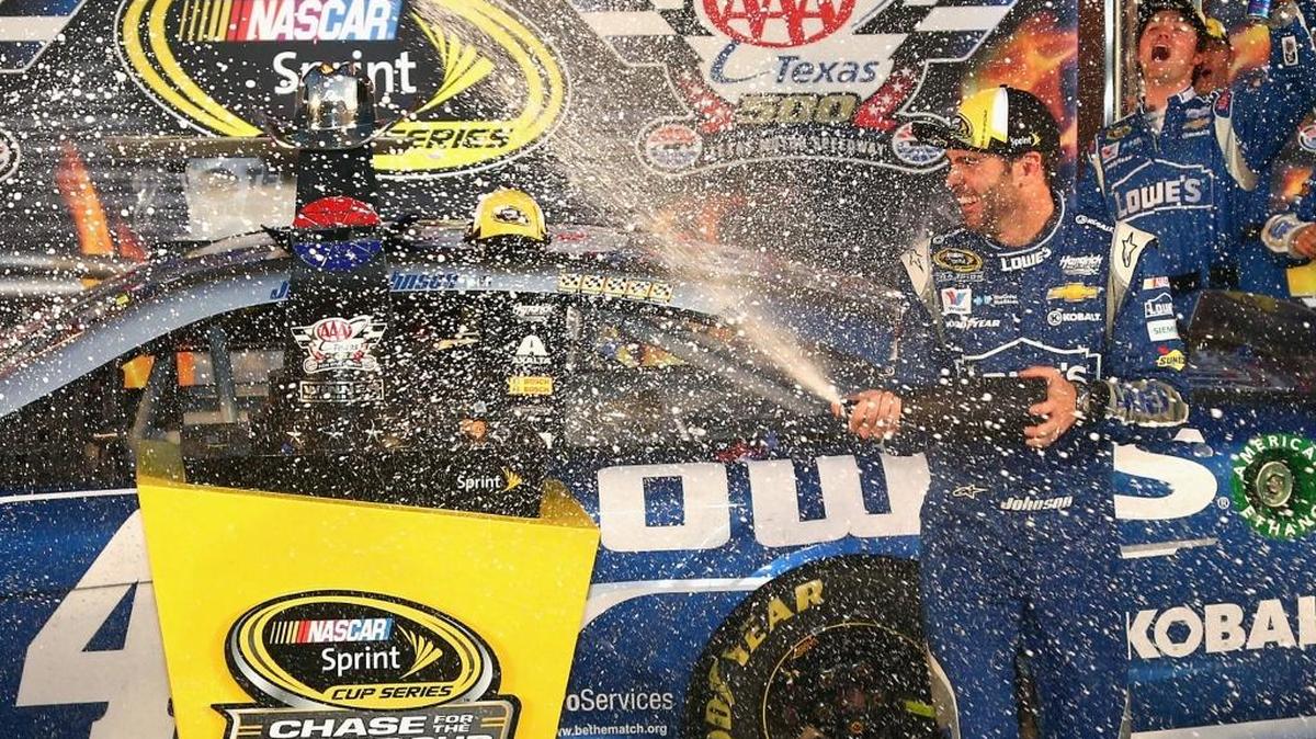 Jimmie Johnson celebrates after winning Sunday’s NASCAR Sprint Cup Series AAA Texas 500 at Texas Motor Speedway.