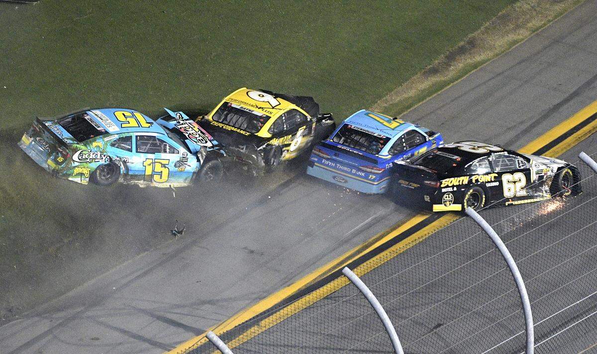 Ross Chastain (15), Trevor Bayne (6), Ricky Stenhouse Jr. (17) and Brendan Gaughan (62) collide along the front stretch during the NASCAR Cup Series auto race at Daytona International Speedway, Saturday, July 7, 2018, in Daytona Beach, Fla. (AP Photo/Phelan M. Ebenhack)