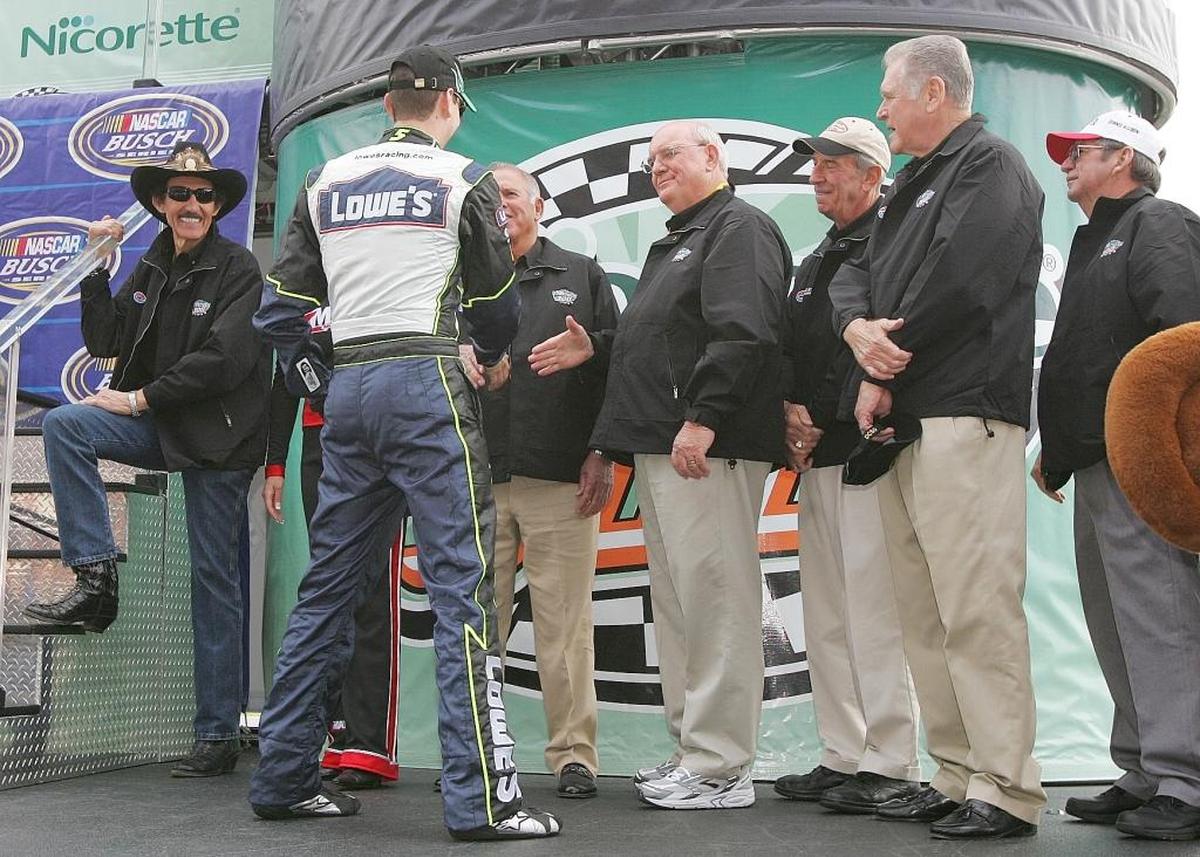 Kyle Busch, front, shakes hands with NASCAR legends, from left, Richard Petty, David Pearson, Benny Parsons, Ned Jarrett, Buddy Baker and Donnie Allison before a 2006 Xfinity Series (then called Busch Series) race at Atlanta Motor Speedway in Hampton, Ga., in 2006.