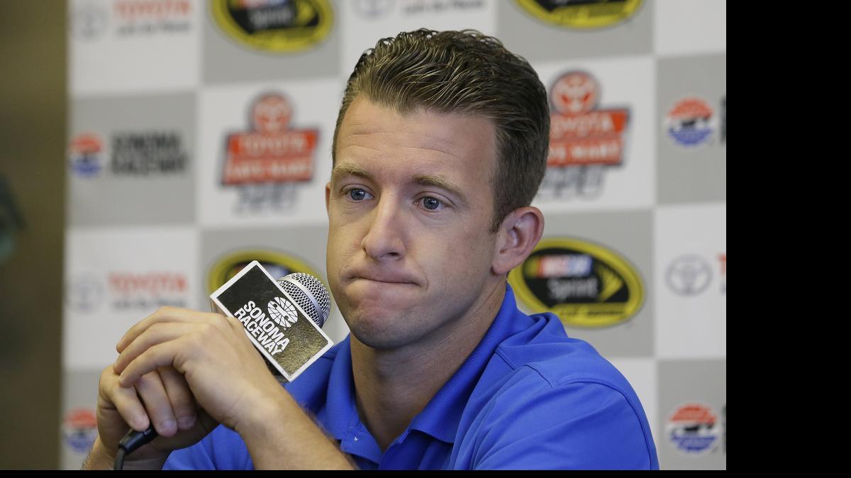 
A.J. Allmendinger answers questions at a news conference before practice for the NASCAR Sprint Cup Series auto race Friday, June 26, 2015, in Sonoma, Calif. 
