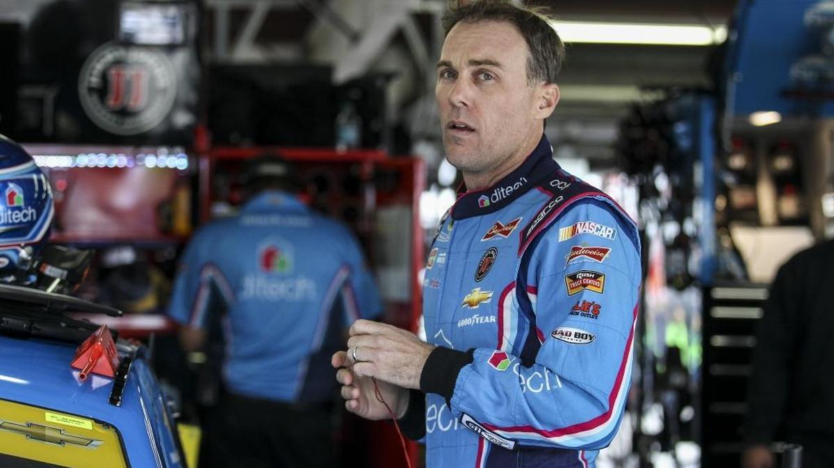 
Driver Kevin Harvick waits in the garage while his car is worked on during Friday’s practice for Sunday's NASCAR Sprint Cup series auto race at New Hampshire Motor Speedway in Loudon, N.H.
