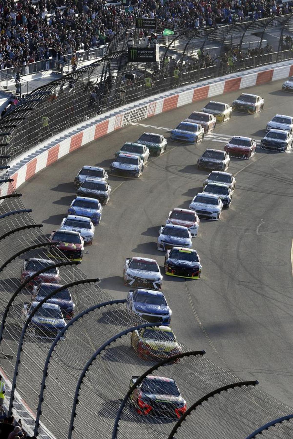 Cars line up at the start of NASCAR Cup series race at Richmond Raceway in Richmond, Va., in April. On Saturday at the track, 26-year-old Israeli driver Alon Day will make his 2018 Cup series debut driving the BK Racing No. 23 Best Bully Sticks Toyota Camry in the Federated Auto Parts 400.