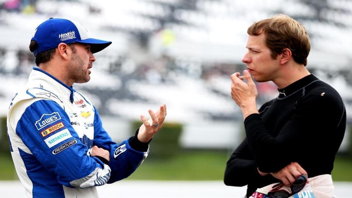 Jimmie Johnson left, talks with Brad Keselowski during practice for Sunday’s NASCAR Sprint Cup Series Axalta "We Paint Winners" 400 at Pocono Raceway in Long Pond, Pa.