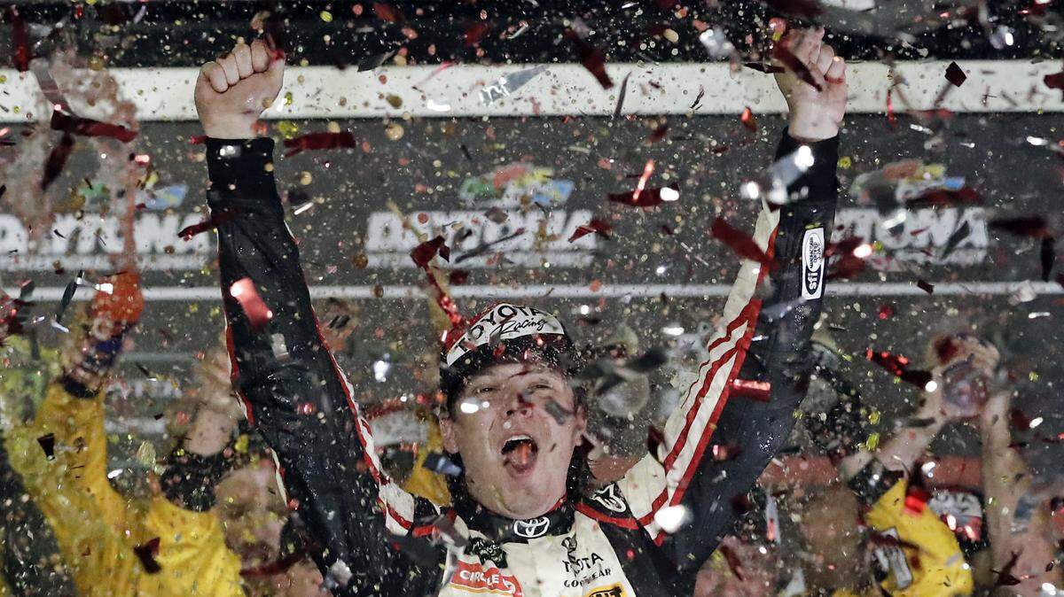 Erik Jones celebrates in Victory Lane after winning the NASCAR Cup Series auto race at Daytona International Speedway, Saturday, July 7, 2018, in Daytona Beach, Fla. (AP Photo/John Raoux)