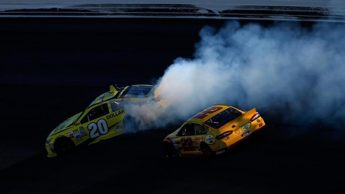 Joey Logano (22) sends Matt Kenseth (20) spinning late on Logano’s way to winning last week’s race at Kansas.