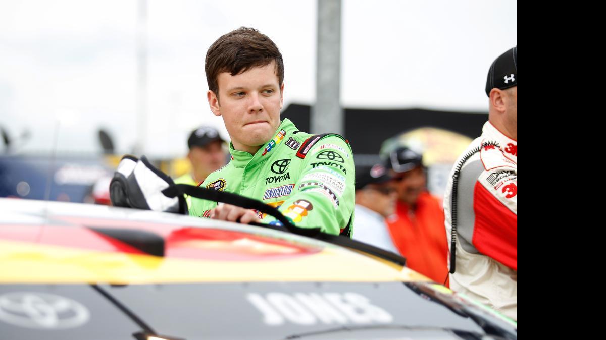 
Erik Jones, driver of the #18 M&M's Red Nose Day Toyota, stands on pit road before the start of the NASCAR Sprint Cup Series SpongeBob SquarePants 400 at Kansas Speedway on May 9, 2015 in Kansas City, Kansas. 
