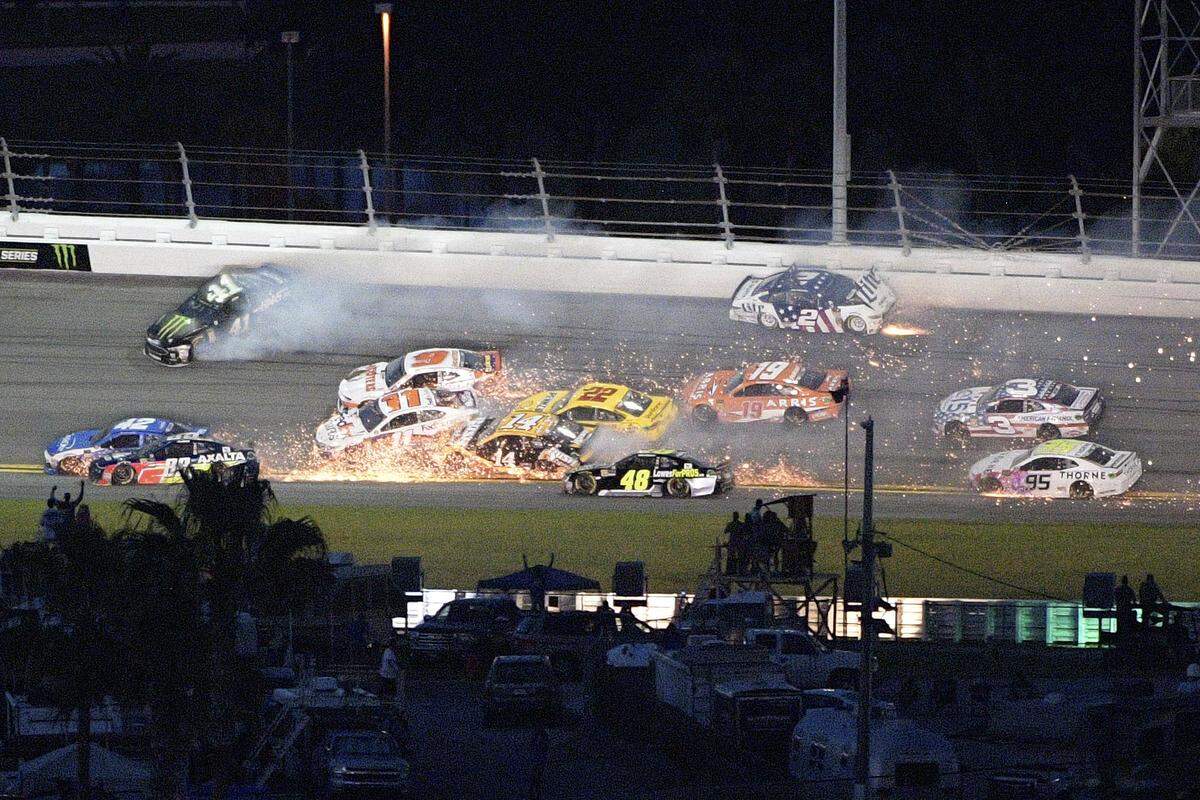 Kyle Larson (42), Alex Bowman (88), Kurt Busch (41), Denny Hamlin (11), Chase Elliott (9), Clint Bowyer (14), Joey Logano (22), Jimmie Johnson (48), Brad Keselowski (2) and Daniel Suarez (19), get caught in a multi-car accident in Turn 3 as Austin Dillon (3) and Kasey Kahne (95) try to avoid them during the NASCAR Cup Series auto race at Daytona International Speedway, Saturday, July 7, 2018, in Daytona Beach, Fla. (AP Photo/Phelan M. Ebenhack)