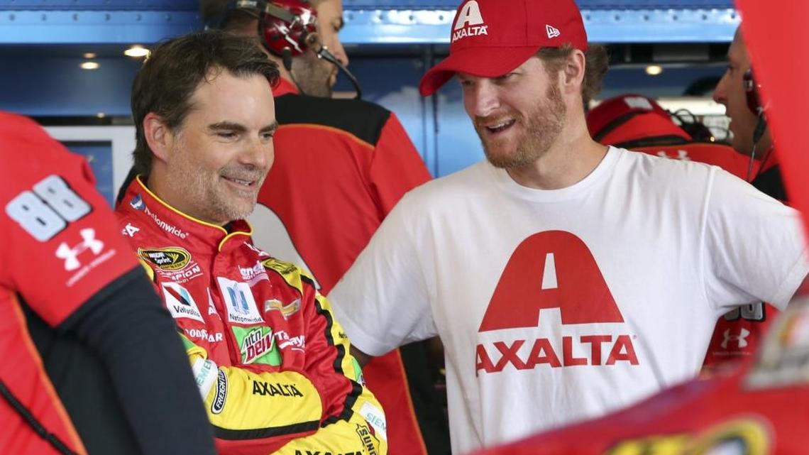 Dale Earnhardt Jr. (right) spoke with substitute driver Jeff Gordon at Watkins Glen International in August. Earnhardt is back for the entire weekend at Dover International Speedway.