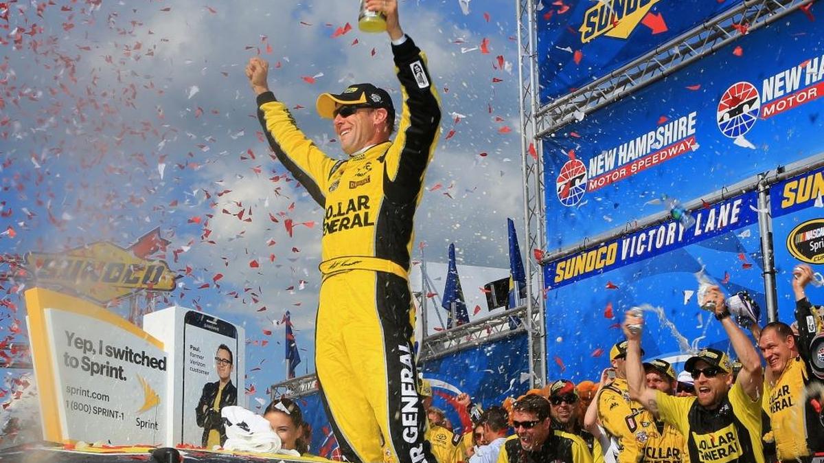 Matt Kenseth, driver of the #20 Dollar General Toyota, celebrates in Victory Lane after winning the NASCAR Sprint Cup Series New Hampshire 301 at New Hampshire Motor Speedway on July 17, 2016, in Loudon, New Hampshire.