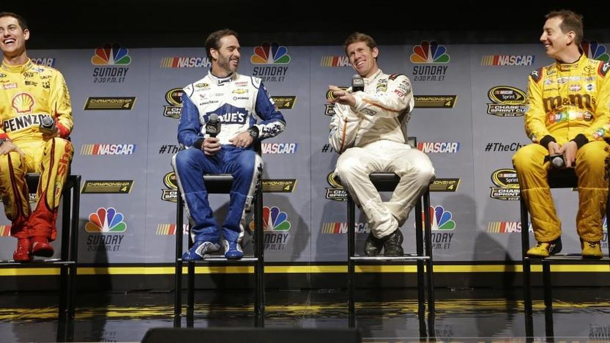 Joey Logano, left, Jimmie Johnson, second from left, and Kyle Busch, right, laugh at a remark by Carl Edwards during a NASCAR Sprint Cup Series news conference Thursday in Miami Beach, Fla. The four will be competing for the season title this weekend.