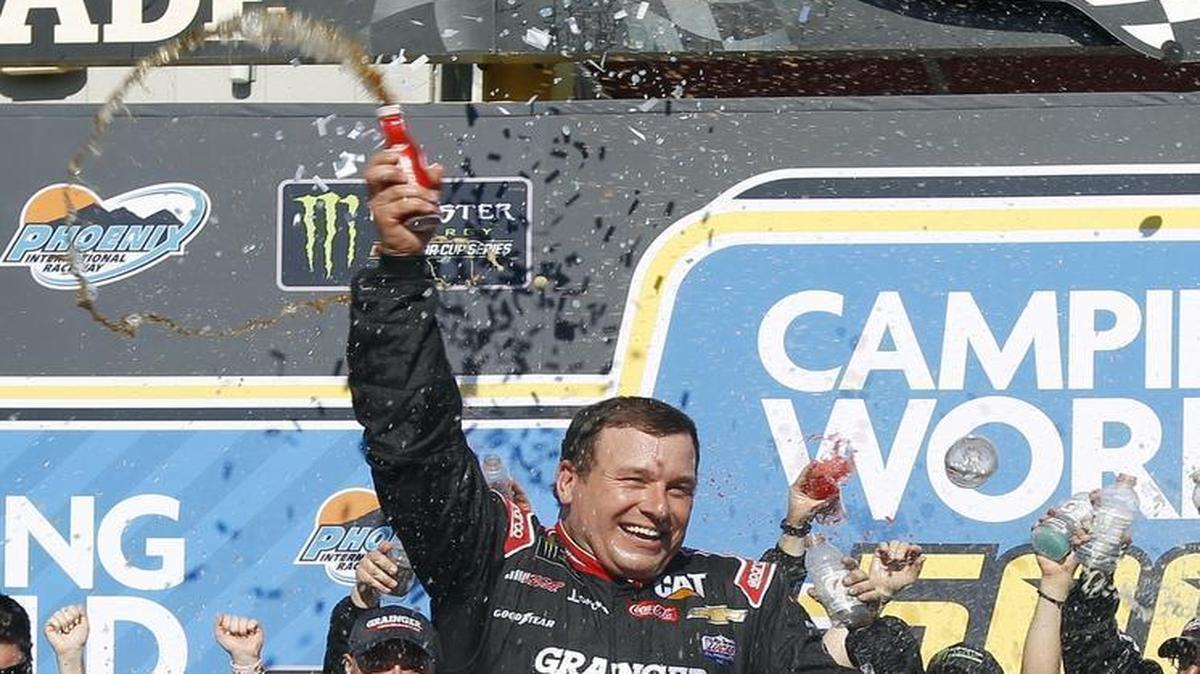 Ryan Newman celebrates in Victory Lane after winning Sunday’s NASCAR Cup Series auto race at Phoenix International Raceway.