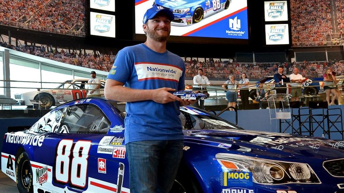 Dale Earnhardt Jr. poses with a die cast of the No. 88 Nationwide Chevrolet that he will drive in his final Southern 500 at Darlington Raceway over the Labor Day weekend. The car’s colors showcase the car he drove to consecutive NASCAR Xfinity Series Championships in 1998 and 1999.
