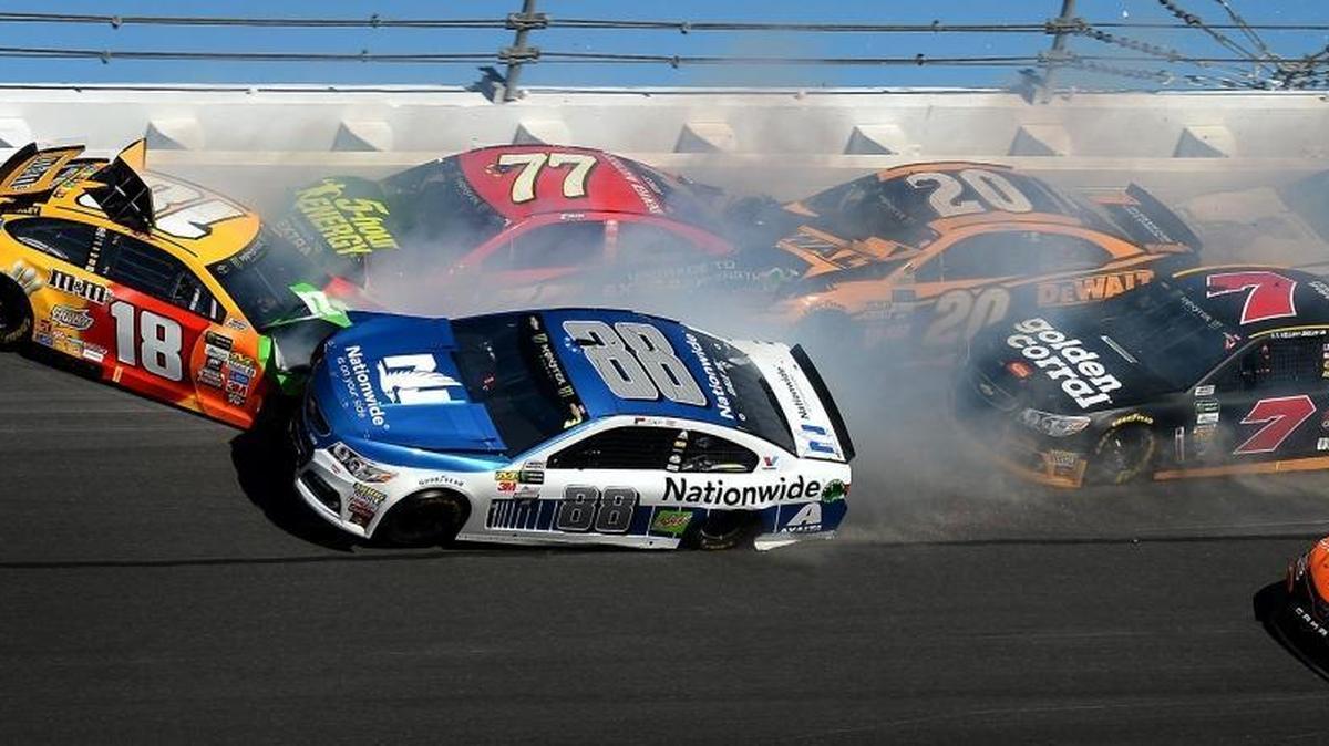 NASCAR driver Dale Earnhardt Jr. (88) is caught up in a wreck with driver Kyle Busch (18), Erik Jones (77), Matt Kenseth (20) and Ty Dillon (13) in Turn 3 during Sunday’s Daytona 500.