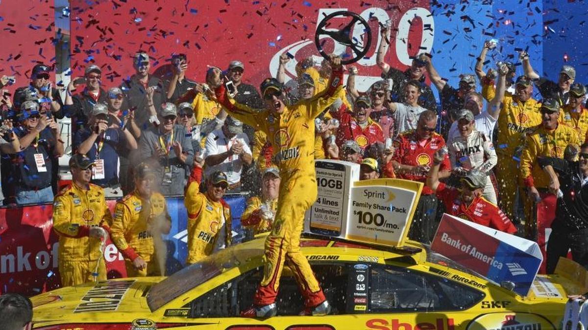 
Joey Logano, driver of the Shell Pennzoil Ford celebrates in victory lane after winning the NASCAR Sprint Cup Bank of America 500 at Charlotte Motor Speedway, Sunday, October 11, 2015. 
