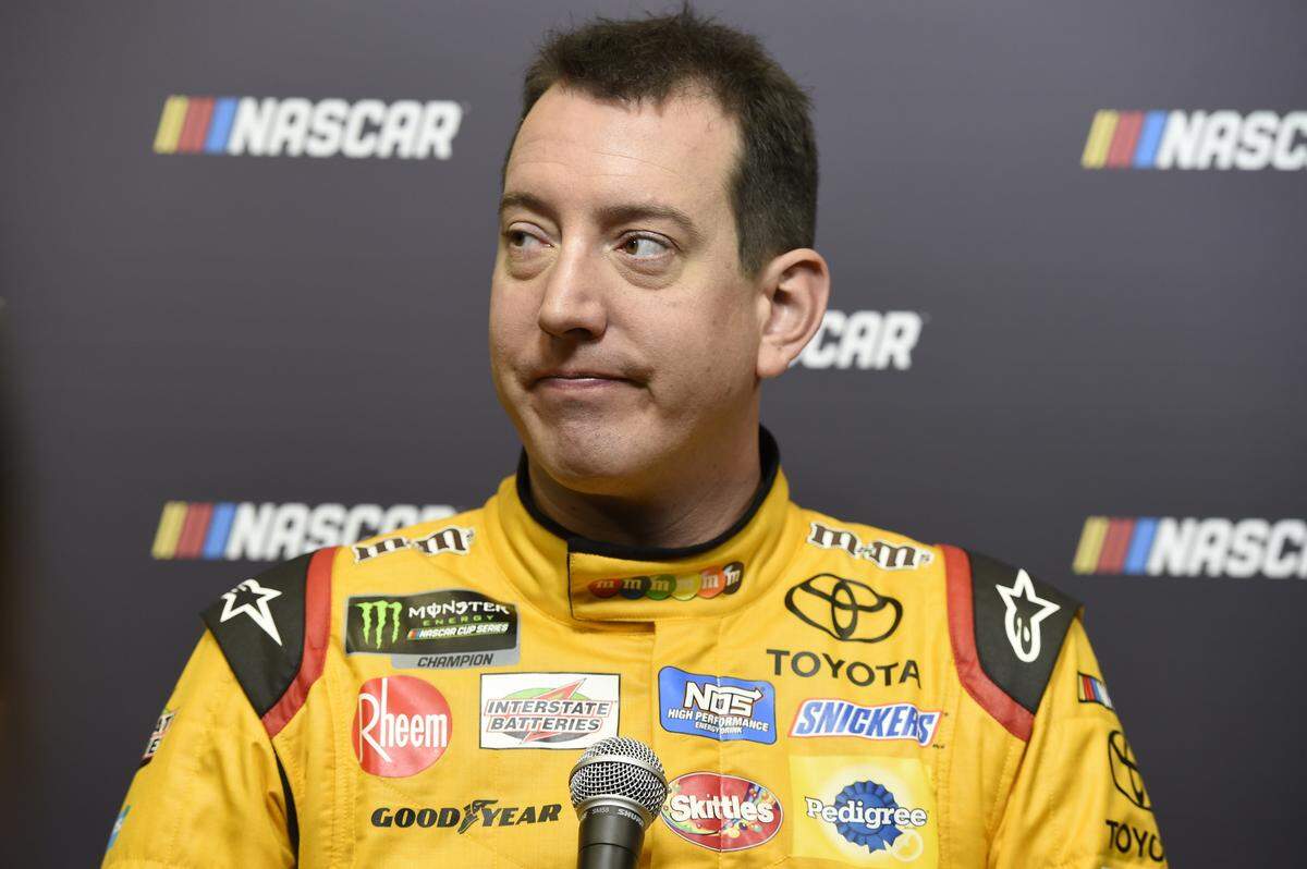 Kyle Busch listens to a question during the NASCAR Media Tour in Charlotte, N.C.,Tuesday, Jan. 23, 2018. (AP Photo/Mike McCarn)