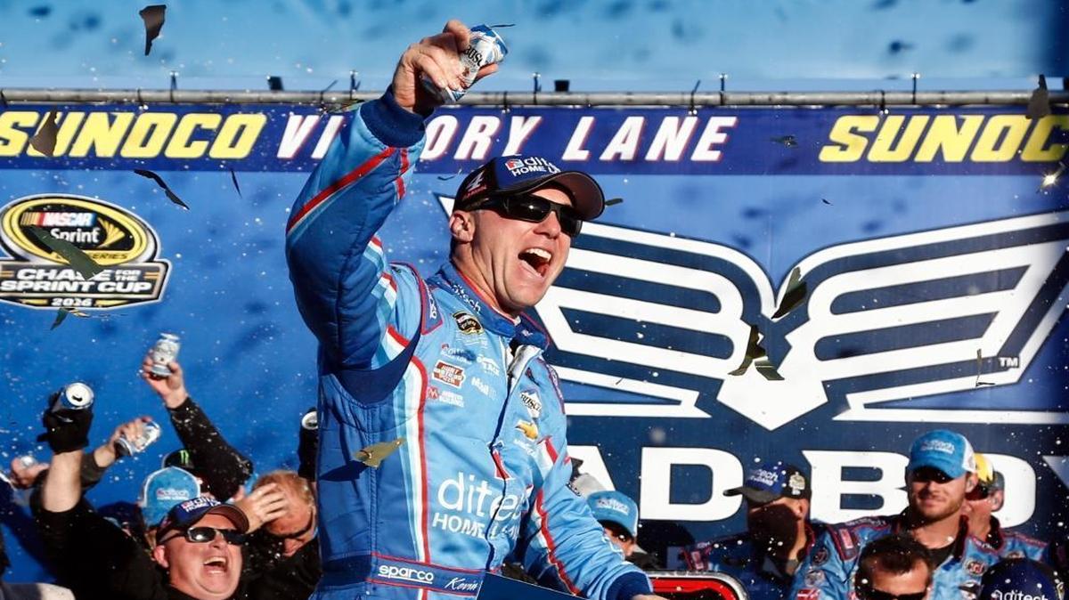 Kevin Harvick celebrates in Victory Lane after winning Sunday’s NASCAR Sprint Cup Series Bad Boy Off Road 300 at New Hampshire Motor Speedway in Loudon, N.H.