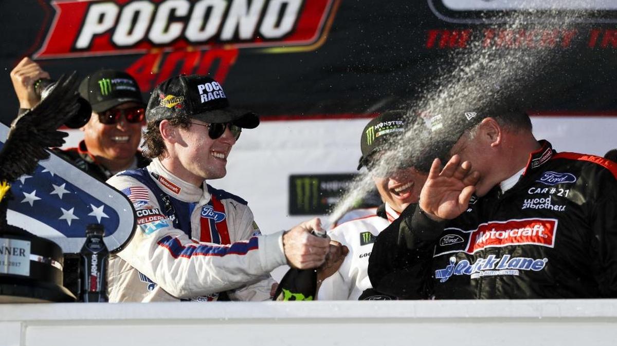Ryan Blaney celebrates in Victory Lane after winning Sunday’s NASCAR Cup Series Pocono 400 auto race in Long Pond, Pa.