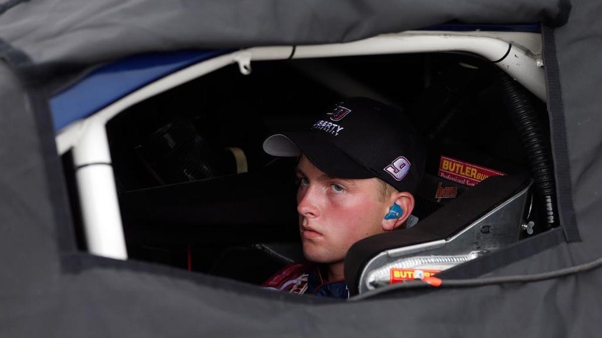 William Byron, driver of the No. 9 Liberty University Chevrolet, sits inside his rain covered car during qualifying for the K&N Pro Series East UNOH 100 at Richmond International Raceway in September.