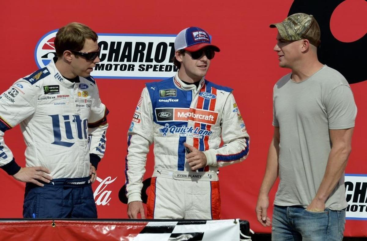 Actor Channing Tatum, best known for his roles in the “Magic Mike” movies, says he’s fascinated by what he’s seen in NASCAR garages. Above, drivers Brad Keselowski and Ryan Blaney chat with Tatum before Sunday’s Coca-Cola 600.