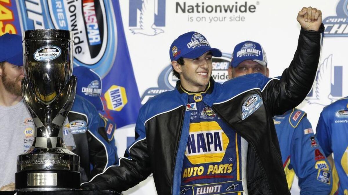In this Nov. 15, 2014, file photo, Chase Elliott celebrates after winning the championship of the NASCAR Nationwide series in Homestead, Fla.