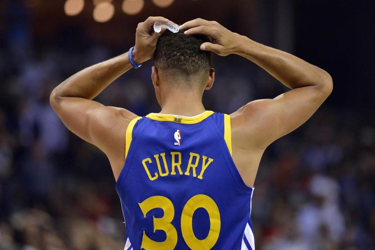 Golden State Warriors guard Stephen Curry reacts during the second half of an NBA basketball game against the Memphis Grizzlies on Saturday, Oct. 21, 2017, in Memphis, Tenn. (AP Photo/Brandon Dill)