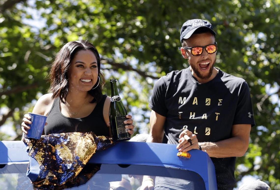Stephen and Ayesha Curry, seen above at Thursday’s parade, reportedly have matching tattoos with a Hebrew phrase that means “Love never fails.”