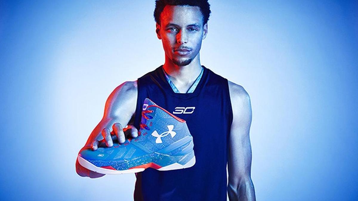 Golden State Warriors and Charlotte native Stephen Curry holds his new Under Armour Curry Two “Providence Road,” which pay homage to his hometown.
