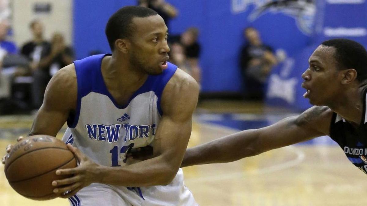 Akil Mitchell, left, as he looks to pass the ball during an NBA summer league basketball game in Orlando, Fla. The former Charlotte Christian and Virginia basketball player’s eye popped out of its socket after he was poked in the face during a pro game in New Zealand.