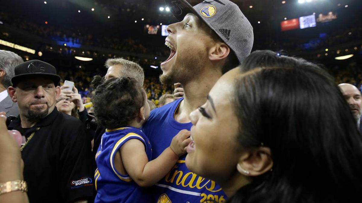 Stephen Curry of the Golden State Warriors celebrates with his wife, Ayesha, and younger daughter Ryan, at the Western Conference Finals in May.